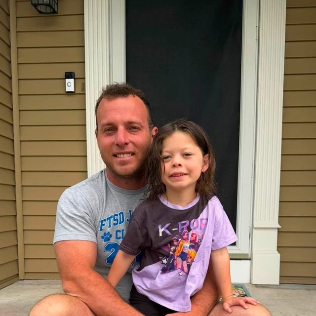 Mark and his daughter on the front steps